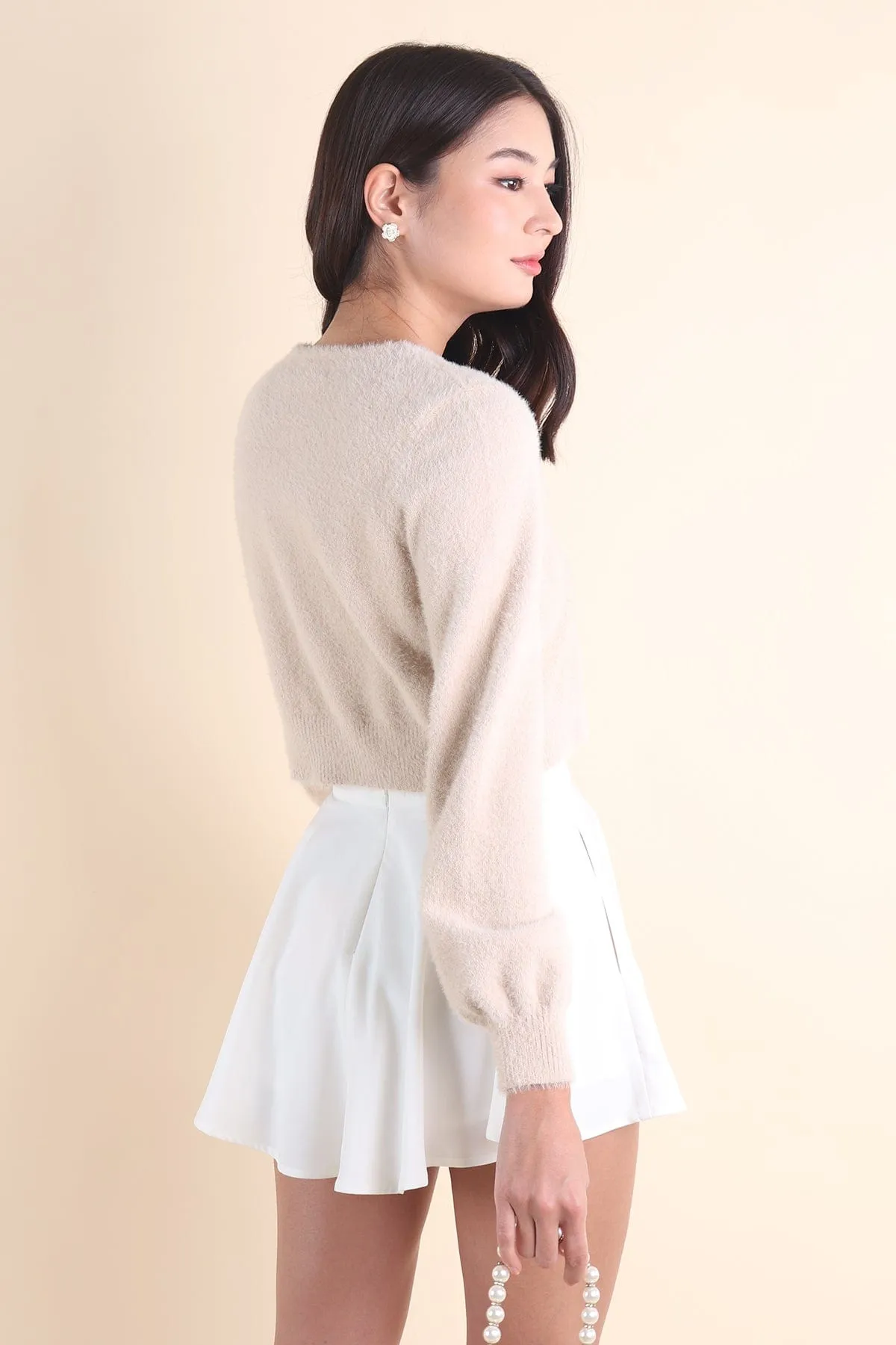 ELIZ BOW FURRY CARDIGAN IN ALMOND